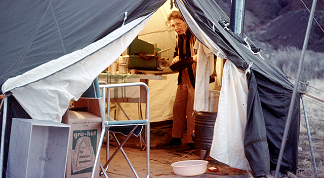 45KT28. Kay Nelson preparing an evening meal.