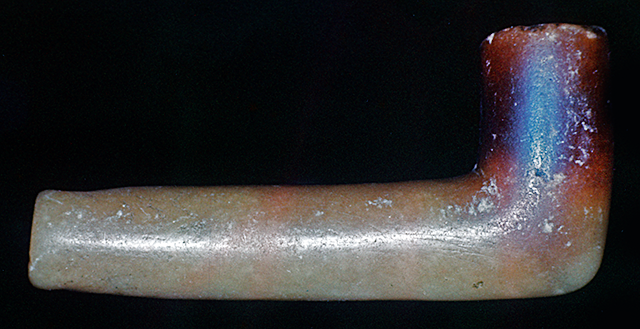 45KT28/58. Pipe of alabaster-like material from Cultural Component VIIH, Cayuse III Subphase. Tooth ware suggests this pipe was used without a stem for a period of time.