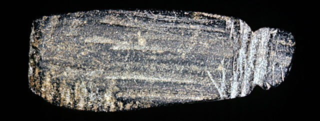 45KT28/97. STEATITE PENDANT, FORM 2, PROBABLY MADE FROM A PIPE BOWL FRAGMENT. CULTURAL COMPONENT VIIH, CAYUSE III SUBPHASE. 45KT28/97. Steatite pendant, Form 2, probably made from a pipe bowl fragment. Cultural Component VIIIH, Cayuse III Subphase.